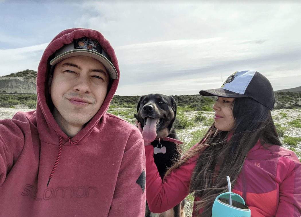 Ed and his girlfriend having a mate at the beach